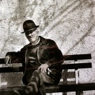 View "Elderly man on park bench in Portugal"